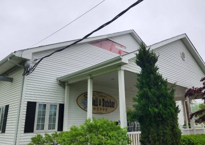 Wind Damage - Removed damaged vinyl siding - installation of new siding & replaced fascia